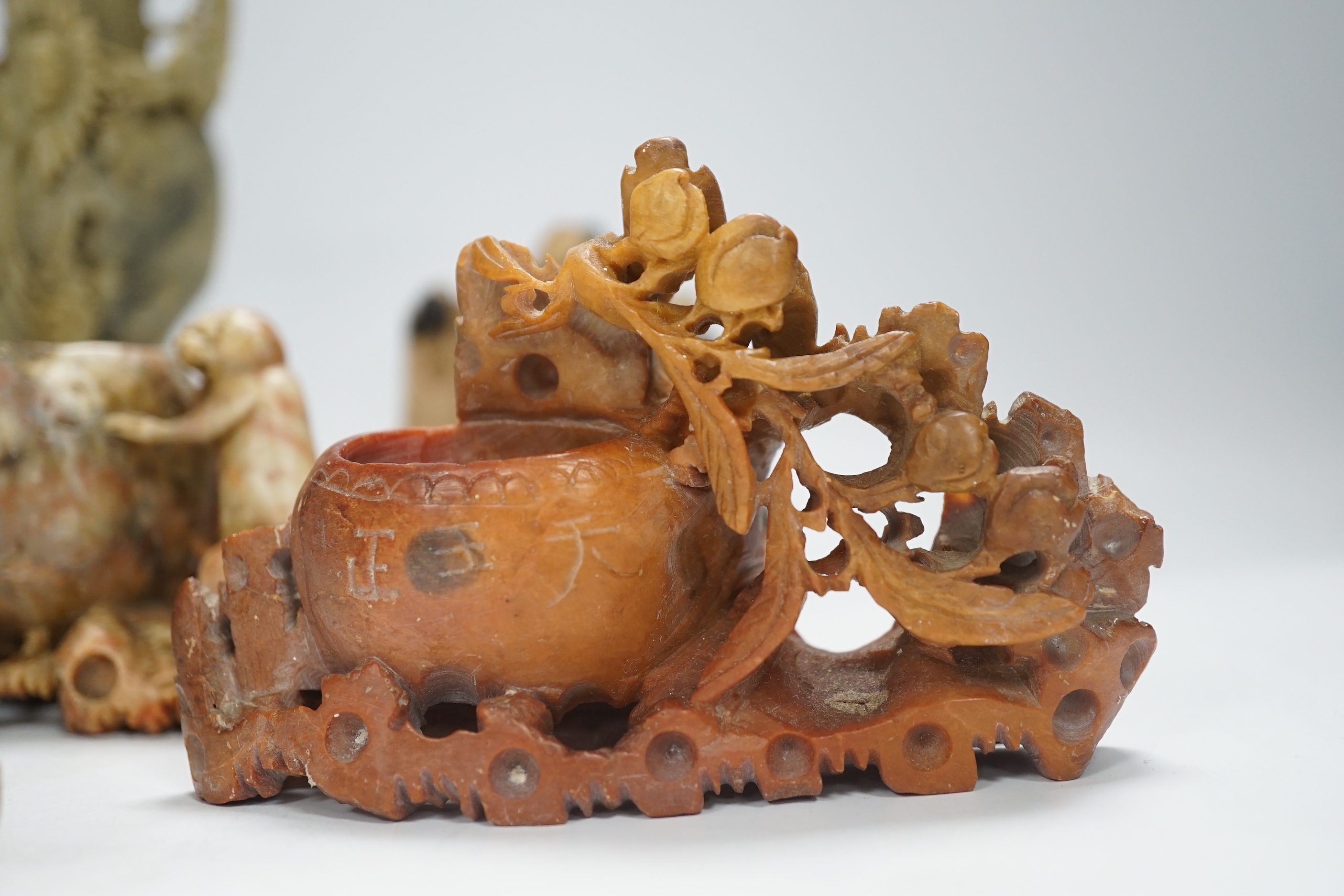 Eight early 20th century Chinese soapstone brushwashers, vases and carvings, largest 16cm high